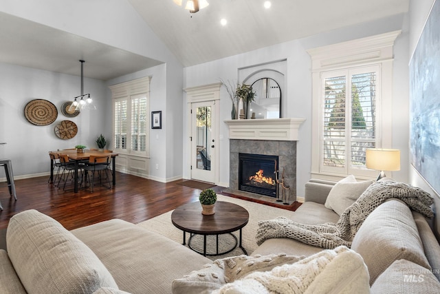 1814 E Grand Canyon Dr, Meridian, ID 83646 - living room featuring a fireplace, recessed lighting, baseboards, wood finished floors, and lofted ceiling