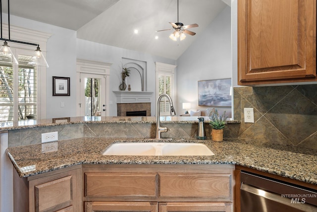 1814 E Grand Canyon Dr, Meridian, ID 83646 - kitchen with ceiling fan, a sink, dishwasher, stone countertops, and backsplash