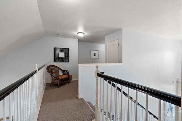 1814 E Grand Canyon Dr, Meridian, ID 83646 - hallway with carpet floors, visible vents, vaulted ceiling, and an upstairs landing