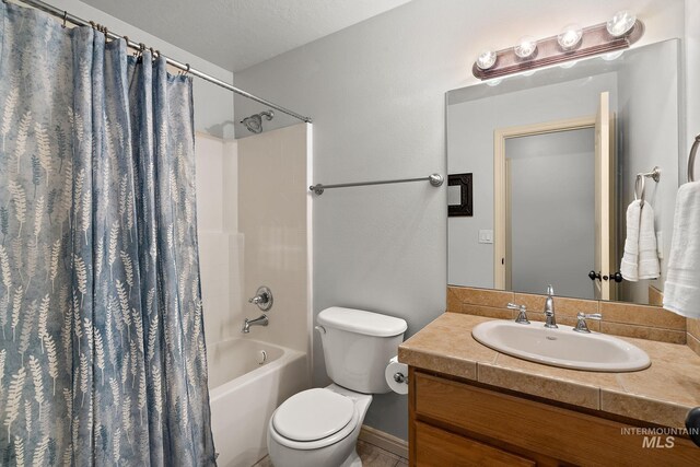 1814 E Grand Canyon Dr, Meridian, ID 83646 - bathroom featuring vanity, shower / bathtub combination with curtain, and toilet