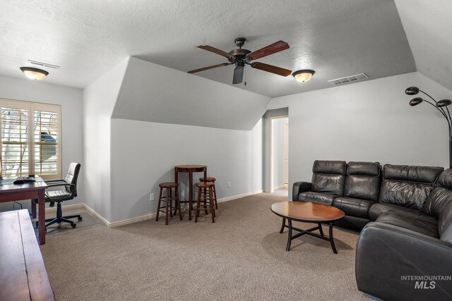 1814 E Grand Canyon Dr, Meridian, ID 83646 - carpeted living room featuring visible vents, a textured ceiling, ceiling fan, and lofted ceiling