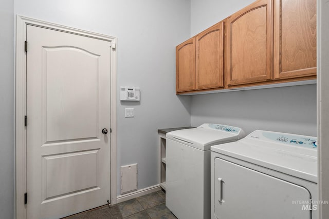 1814 E Grand Canyon Dr, Meridian, ID 83646 - laundry room with baseboards, washer and clothes dryer, and cabinet space