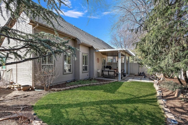1814 E Grand Canyon Dr, Meridian, ID 83646 - rear view of property with a lawn, fence, a shingled roof, and a patio area