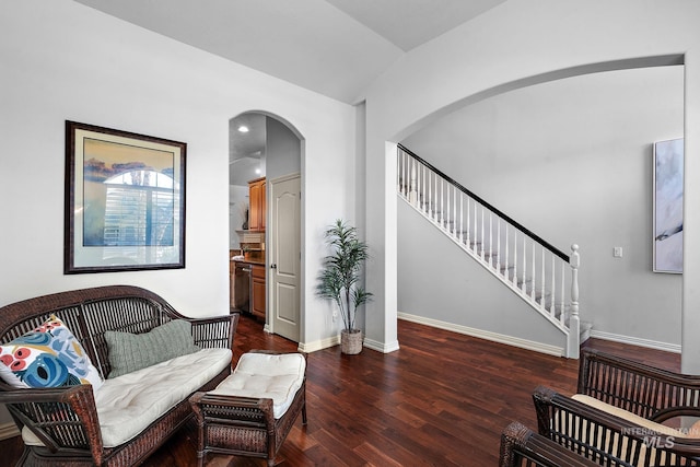 1814 E Grand Canyon Dr, Meridian, ID 83646 - living area featuring arched walkways, baseboards, lofted ceiling, stairs, and dark wood-type flooring