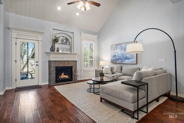 1814 E Grand Canyon Dr, Meridian, ID 83646 - living room featuring a fireplace, baseboards, high vaulted ceiling, dark wood-type flooring, and a ceiling fan