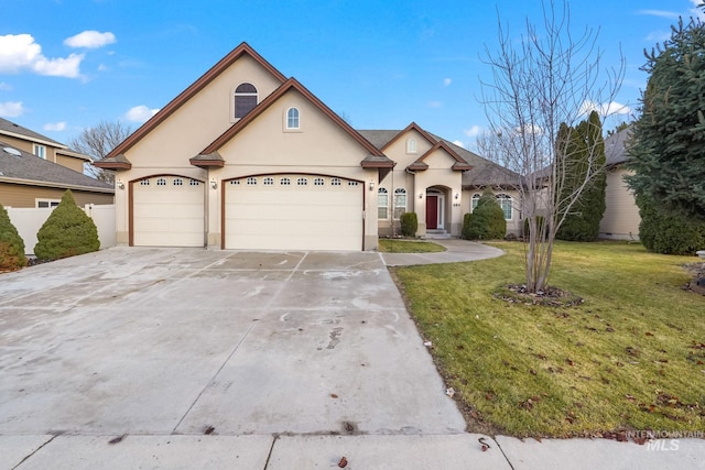 view of front of home featuring a garage and a front yard