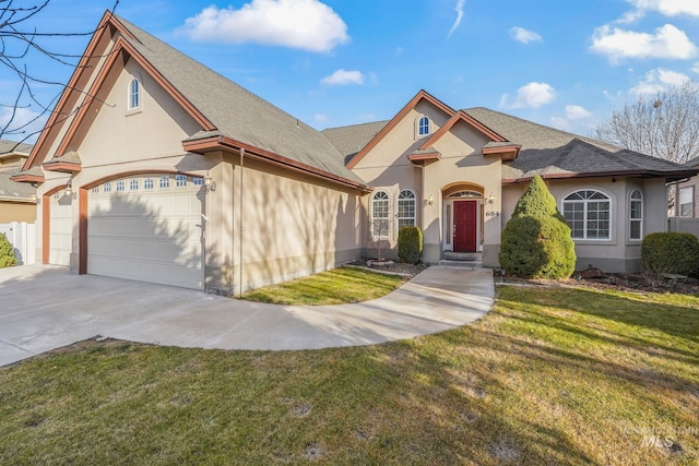 view of front facade featuring a garage and a front yard