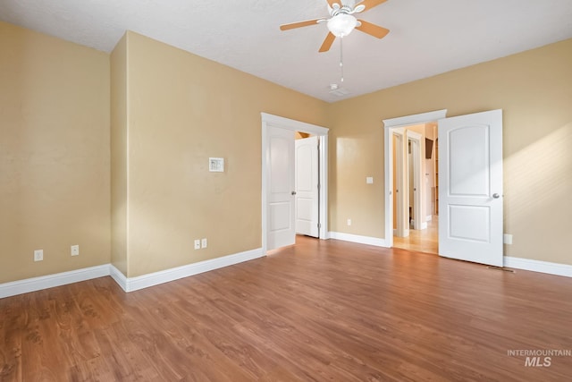 unfurnished bedroom featuring ceiling fan and wood-type flooring