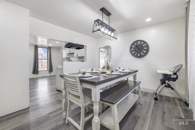 317 W C, Shoshone, ID 83352 - dining room with arched walkways, baseboards, recessed lighting, and wood finished floors