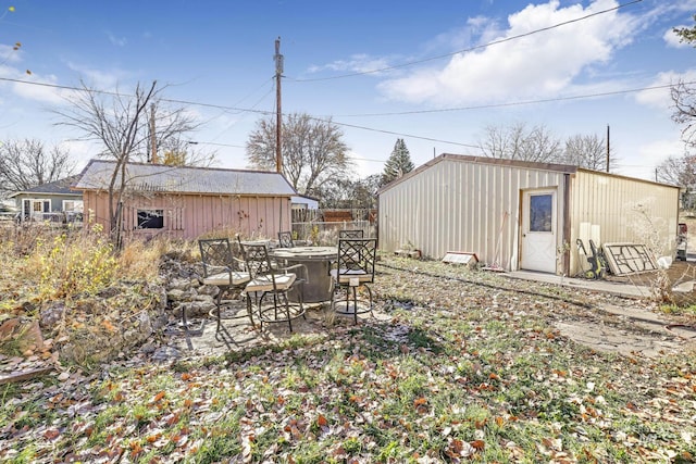 317 W C, Shoshone, ID 83352 - view of yard featuring a fire pit and an outdoor structure