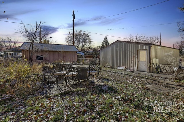 317 W C, Shoshone, ID 83352 - yard at dusk featuring an outdoor structure