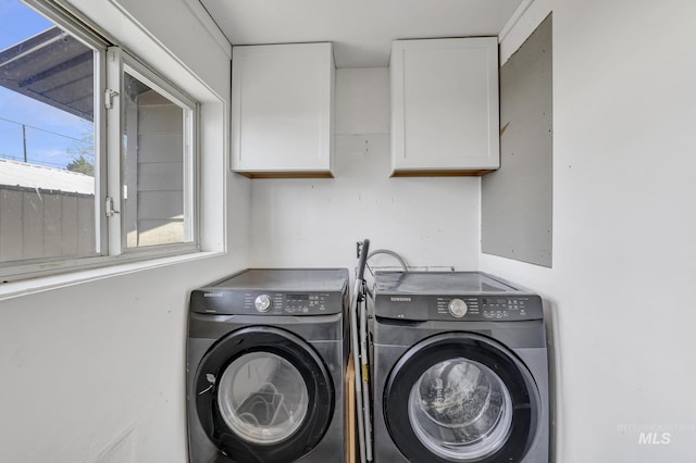 317 W C, Shoshone, ID 83352 - washroom featuring separate washer and dryer, cabinet space, and a wealth of natural light