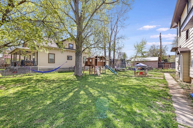 317 W C, Shoshone, ID 83352 - view of yard featuring a playground and fence