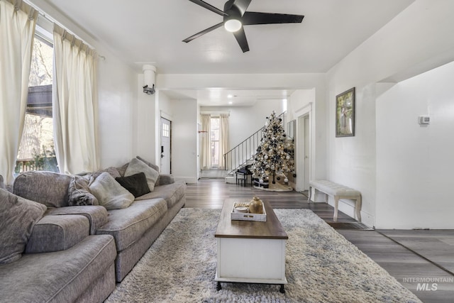 317 W C, Shoshone, ID 83352 - living room with baseboards, ceiling fan, stairs, and wood finished floors
