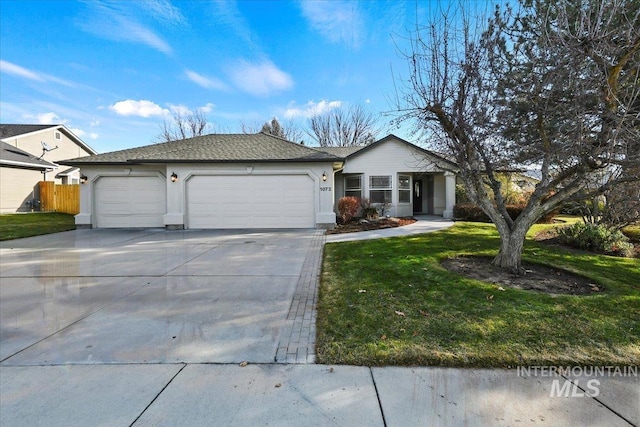 ranch-style home featuring a front lawn and a garage