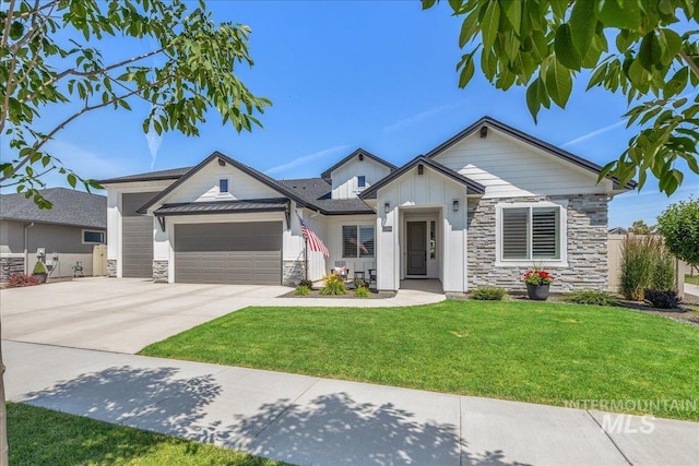 11304 W Helenium Dr, Star, ID 83669 - view of front facade with stone siding, a garage, board and batten siding, and driveway