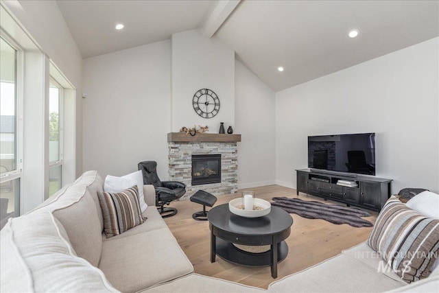 11304 W Helenium Dr, Star, ID 83669 - living room featuring wood finished floors, recessed lighting, and a stone fireplace