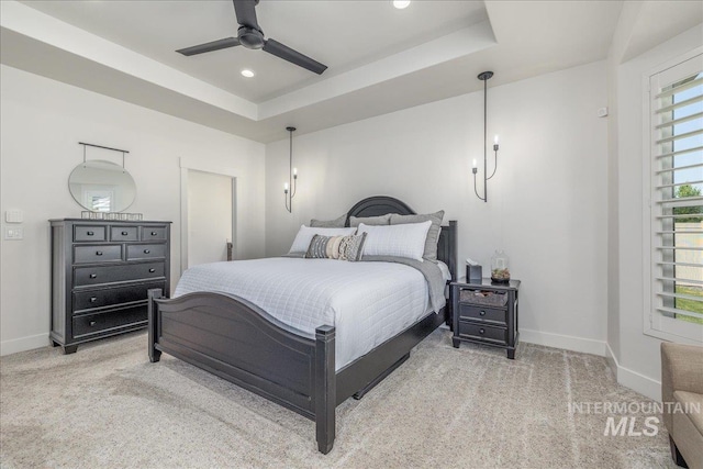11304 W Helenium Dr, Star, ID 83669 - bedroom featuring carpet floors, a tray ceiling, recessed lighting, and a ceiling fan