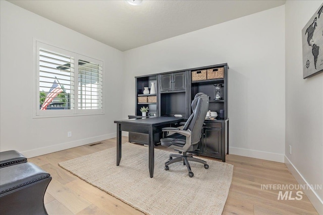 11304 W Helenium Dr, Star, ID 83669 - home office with baseboards and light wood-type flooring