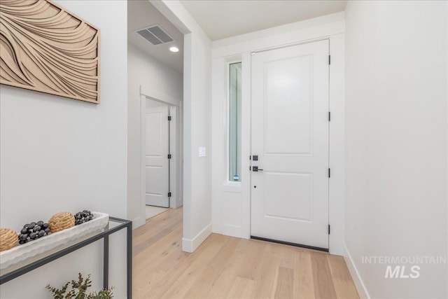 11304 W Helenium Dr, Star, ID 83669 - foyer with light wood finished floors and recessed lighting