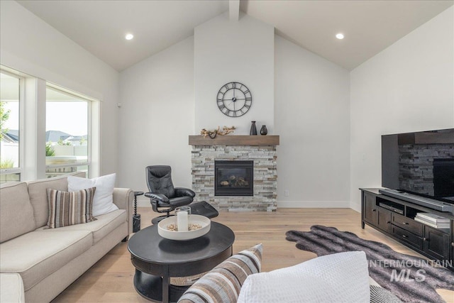 11304 W Helenium Dr, Star, ID 83669 - living area featuring a fireplace, light wood-style floors, high vaulted ceiling, beamed ceiling, and recessed lighting