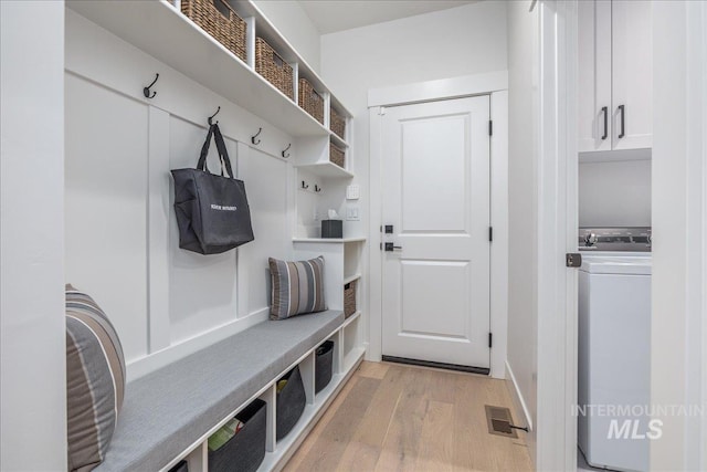 11304 W Helenium Dr, Star, ID 83669 - mudroom featuring light wood finished floors and washer / dryer