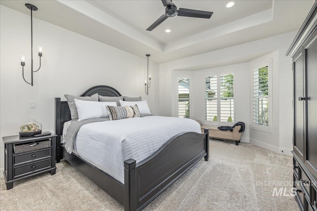 11304 W Helenium Dr, Star, ID 83669 - bedroom featuring light carpet, a tray ceiling, recessed lighting, and a ceiling fan