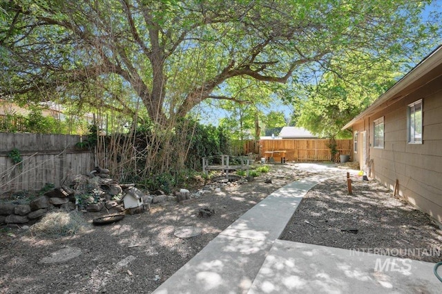 fenced backyard featuring a patio area