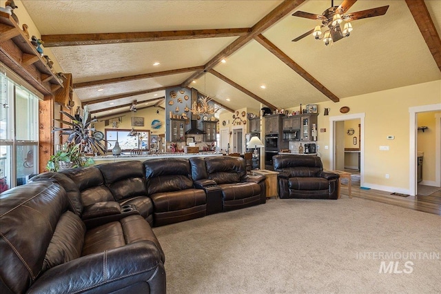 living room featuring ceiling fan, lofted ceiling with beams, a textured ceiling, and carpet flooring