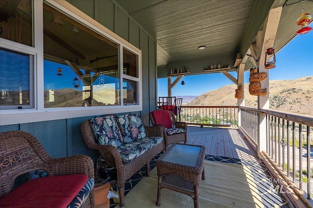 wooden terrace with a mountain view