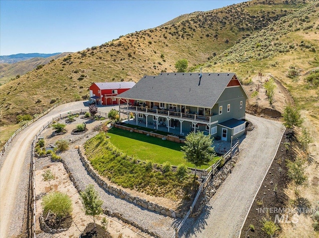 birds eye view of property with a mountain view