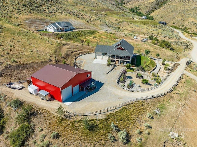 birds eye view of property featuring a rural view