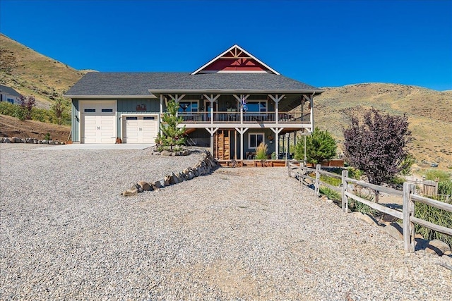 view of front facade with a mountain view and a garage