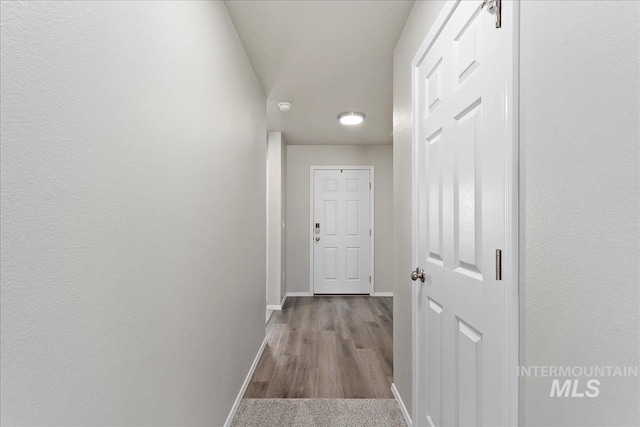 corridor featuring light hardwood / wood-style floors