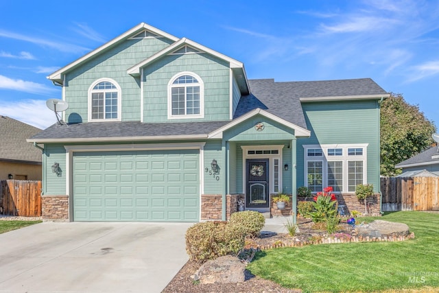 view of front of property with a garage and a front lawn