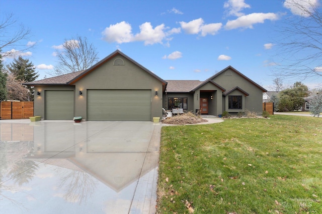 single story home featuring a garage and a front lawn