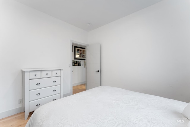 bedroom with light wood-type flooring