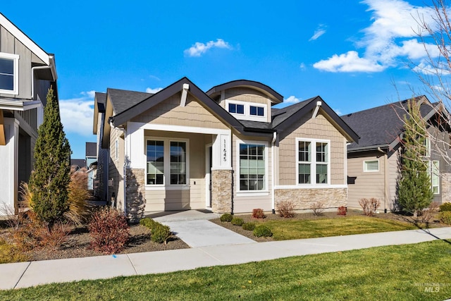 11645 N 24th Ave, Boise, ID 83714 - view of front of house with a front yard and stone siding