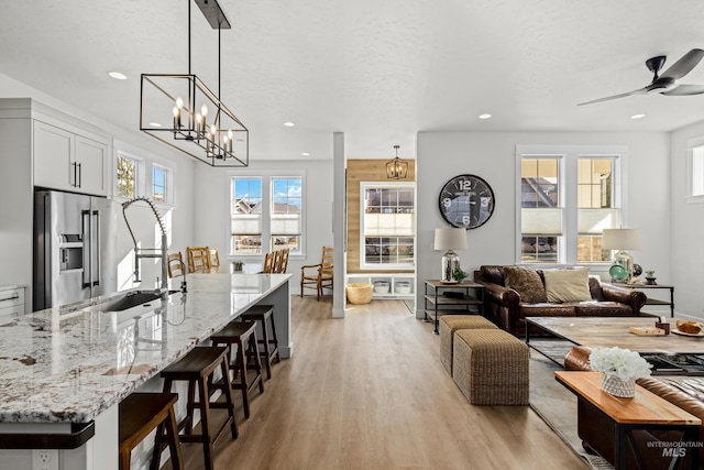 11645 N 24th Ave, Boise, ID 83714 - interior space featuring a textured ceiling, light wood-style flooring, and recessed lighting