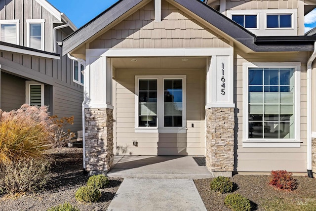 11645 N 24th Ave, Boise, ID 83714 - property entrance featuring stone siding and board and batten siding