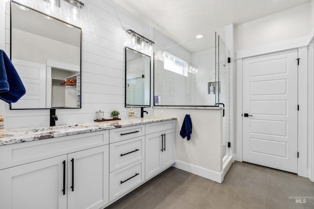 11645 N 24th Ave, Boise, ID 83714 - bathroom featuring double vanity, a sink, tile patterned floors, and a shower stall