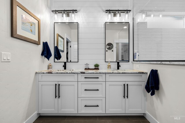 11645 N 24th Ave, Boise, ID 83714 - full bath with double vanity, baseboards, and a sink