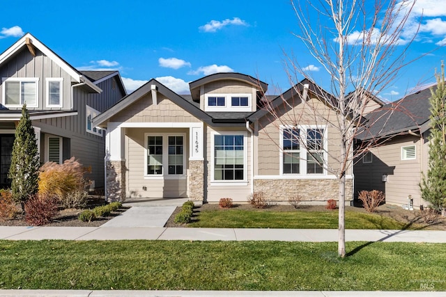 11645 N 24th Ave, Boise, ID 83714 - craftsman inspired home featuring a front lawn and stone siding