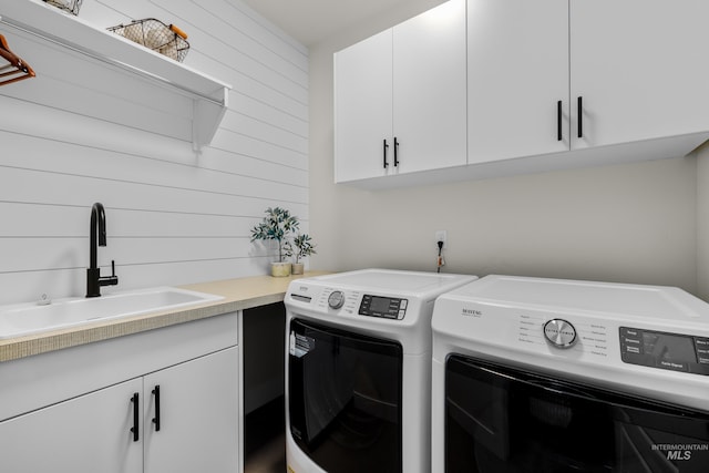 11645 N 24th Ave, Boise, ID 83714 - clothes washing area with a sink, washer and clothes dryer, and cabinet space