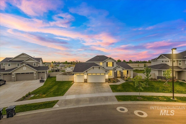 1179 W Ayrshire St, Middleton, ID 83644 - view of front facade featuring driveway, fence, a yard, board and batten siding, and an attached garage