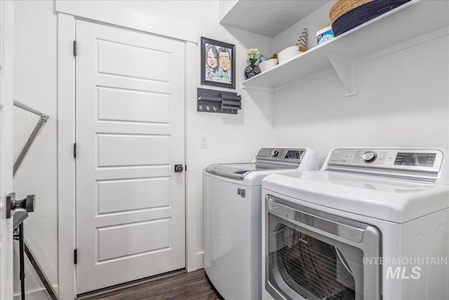 laundry area with laundry area, dark wood-style flooring, and separate washer and dryer