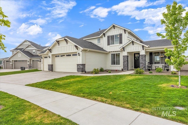 craftsman-style house with an attached garage, concrete driveway, a front lawn, stone siding, and board and batten siding