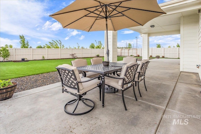 view of patio / terrace with outdoor dining area and a fenced backyard