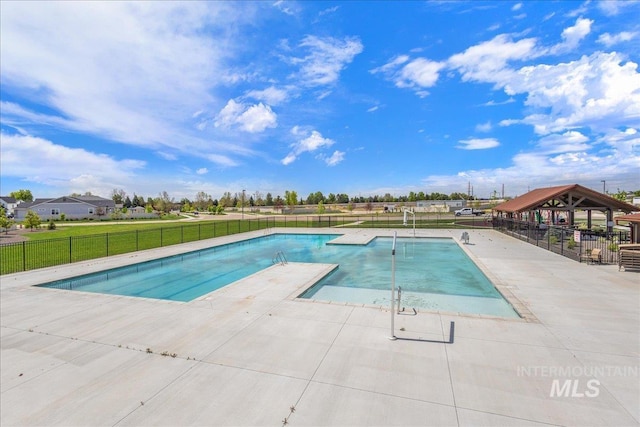 view of pool with a patio area, fence, and a fenced in pool