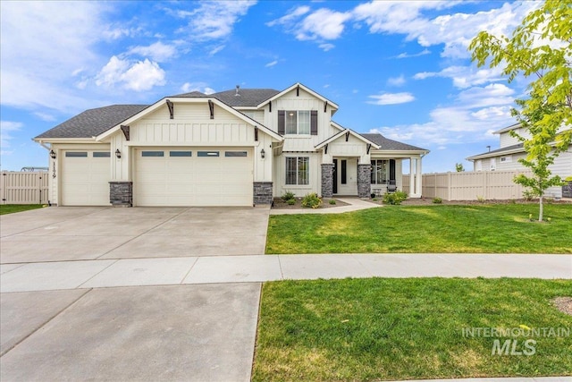 craftsman inspired home featuring a front lawn, board and batten siding, driveway, and fence